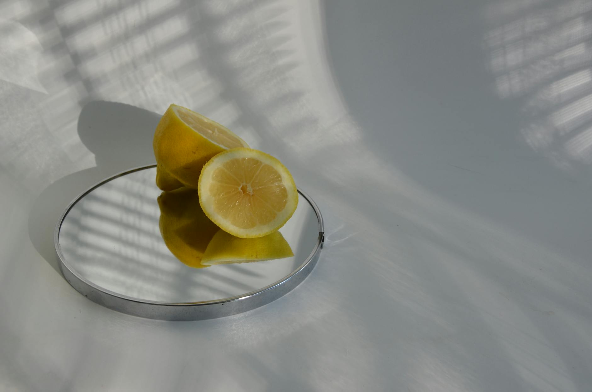 Yellow silicone vibrator surrounded by peeled bananas on a yellow background, symbolizing gentle sensuality and pleasure