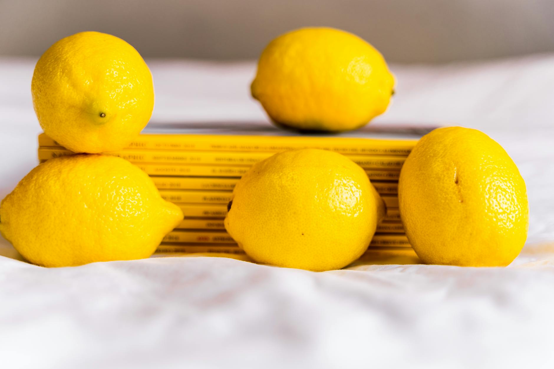Lemon placed carefully on white surface, symbolizing fresh perspective and natural pleasure